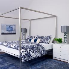Blue and White Bedroom With Silver Canopy Bed