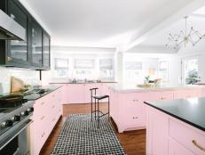contemporary kitchen with pink and black cabinets