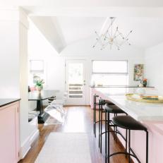 Pink Kitchen Island Complete With Chic Black Barstools