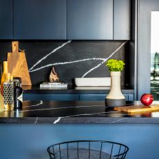 Blue Cabinets, Marble Backsplash Complement Kitchen Island