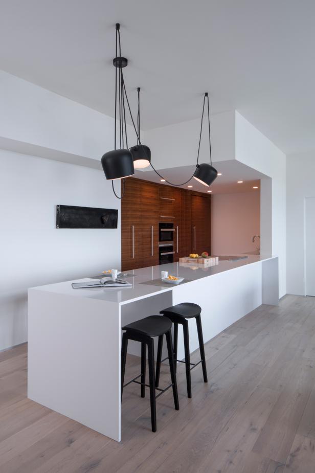 Modern Galley Kitchen With Work Island And Walnut Cabinets ...