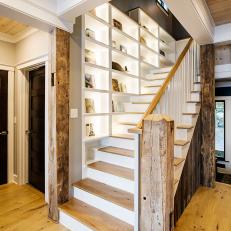 Wood Staircase Lined With Bookshelves