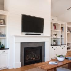 Transitional Living Room Boasts Built-In Shelves, Fireplace