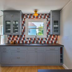 Transitional Kitchen Pairs Blue Cupboards, Geometric Backsplash