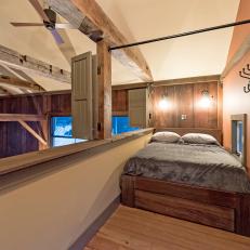 Sleeping Loft in Converted Barn Has Shutters for Privacy
