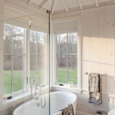 Modern Cottage Bathroom With Contemporary Tub And Wood Paneled Walls