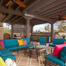 Tropical Covered Patio With Blue Sectionals