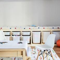 Eames Chair in Child's White Playroom With Splashes of Color