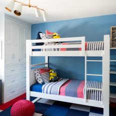 Bunk Beds With Striped Linens Create Cohesion in Kids' Room