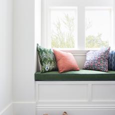 Stylish Window Seat Complete With Patterned Pillows