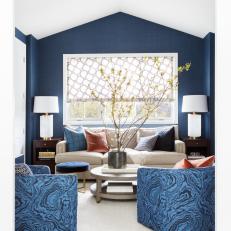 Dark Blue Sitting Room With Neutral Loveseat