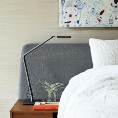 Bed With Gray Headboard and Nightstand