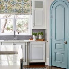 White Chef Kitchen With Blue Arched Door