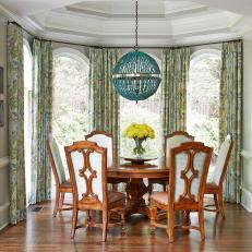 Blue and Green Traditional Dining Room With Blue Pendant