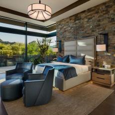 Asian Contemporary Master Bedroom With Stone Wall