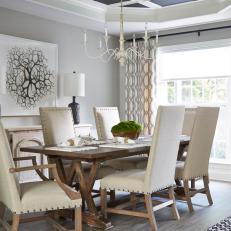 Neutral Transitional Dining Room With Graphic Curtains 