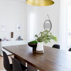 Modern White Dining Room With Wood Table And Midcentury Modern Accents