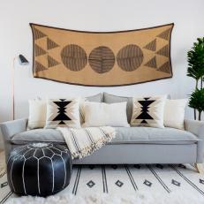 Contemporary Sitting Area With Gray Sofa And Black And Brown Textiles And Accents