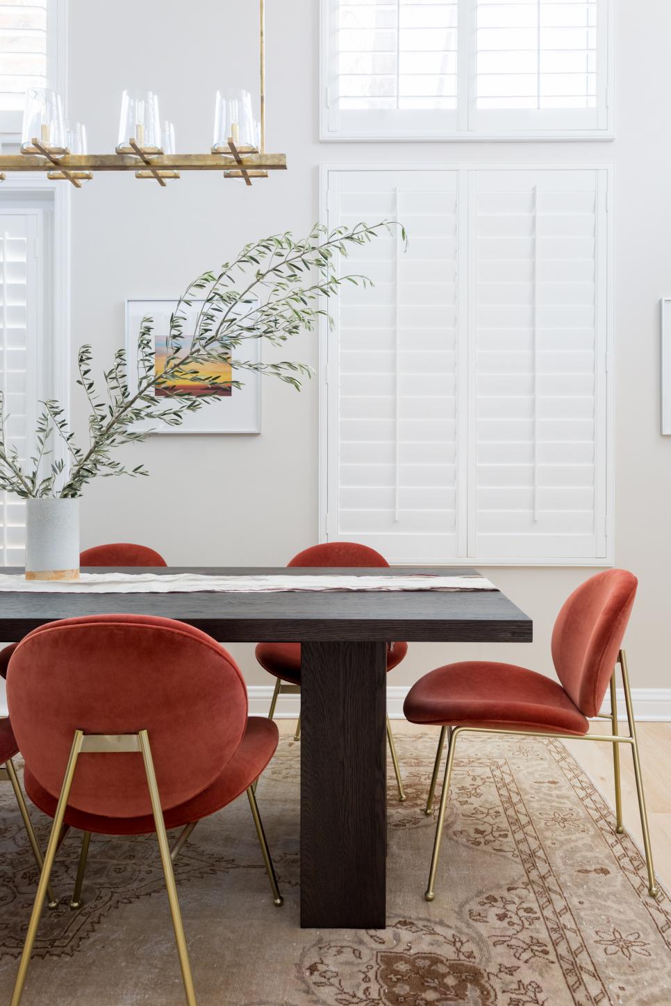 Modern White Dining Room With Red Upholstered Dining ...