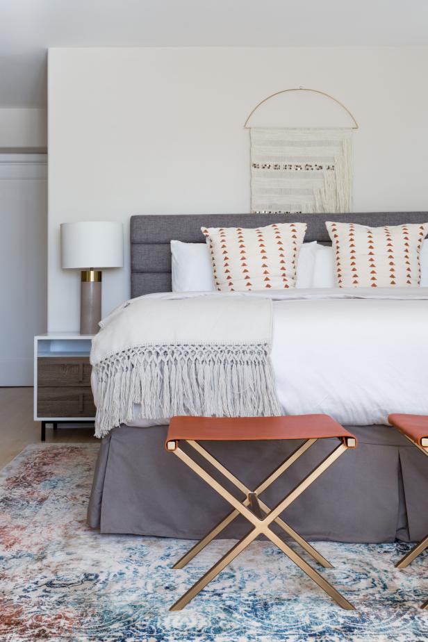 Modern White Master Bedroom With Gray Upholstered Headboard And Gold