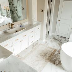 Contemporary White And Neutral Master Bathroom With Marble And Gold Accents