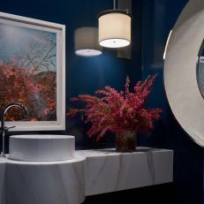 Modern Powder Room With Vessel Sink And Marble Floating Countertop And Blue Walls
