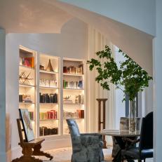 Contemporary Built In Library Shelves With Recessed Lighting And Sitting Area