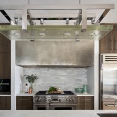 Contemporary Kitchen With Modern Suspended Glass Light And Glass Tile Accents