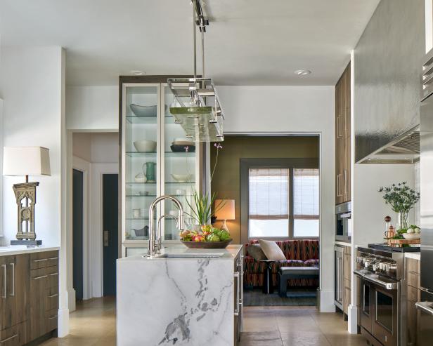 Modern Kitchen With Built In Glass Display Cabinet And Marble Work