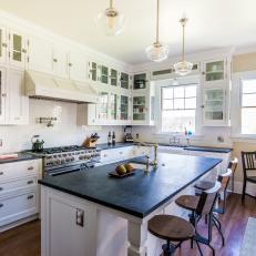 Craftsman-Inspired Transitional Kitchen With White Subway Tile Backsplash and Black Countertop Island