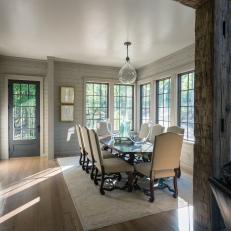 Undressed Windows Allow Stream of Daylight Into Dining Room