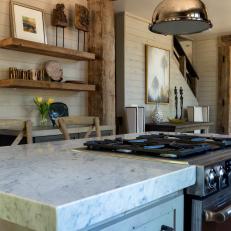 Cabin Kitchen Features Rustic Wood Trim, Thick Marble Countertops