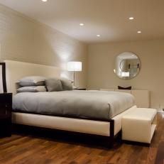 White Urban Master Bedroom With Round Mirror
