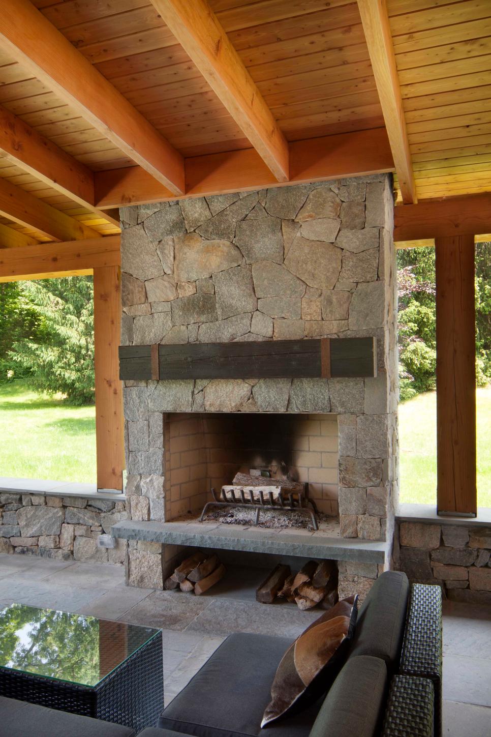 Outdoor Covered Patio Detail With Exposed Beams And Rafters And Stone