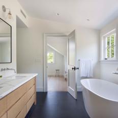 Modern White Master Bathroom With Double Sink Vanity And Soaking Tub
