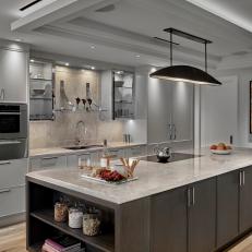 Modern Art Deco Inspired Kitchen With Stone Counter And Backsplash And Illuminated Tray Ceiling