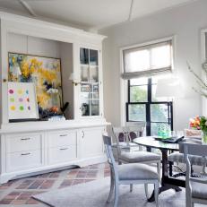 Eclectic Breakfast Nook Showcases Colorful Art Collection