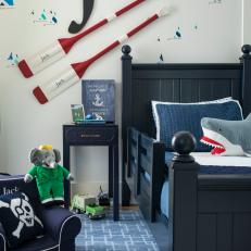 Blue Coastal Kid's Room With Red Oars