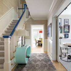 Contemporary Coastal Hall With Blue Bannister