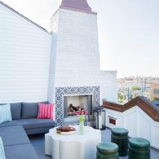 Modern White Cottage Rooftop Living Space With Fireplace