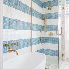 White And Blue Cottage Master Bathroom With Mosaic Glass Tile Wall And Soaking Tub