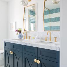 Modern White Cottage Master Bathroom With Blue Double Vanity And Brass Accents