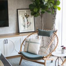Modern Cottage Living Room Detail With Wood And Rope Chair And Built In Cabinet And Shelf