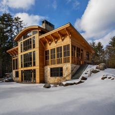 Wood and Glass Cabin Exterior in Snow