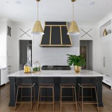 Black and White Chef Kitchen With Gold Accents
