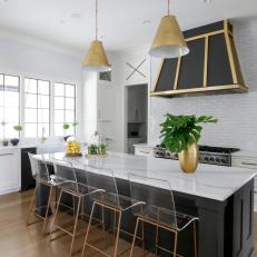 Black, Gold and White Chef Kitchen With Lucite Barstools