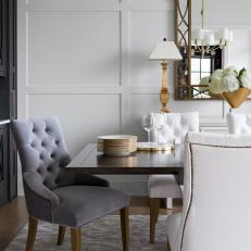 Formal Dining Room With Gray Tufted Chair