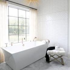 Traditional Master Bath With Soaking Tub And Subway Tile And Modern Pendant Light