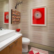 Neutral Powder Room With Red Art