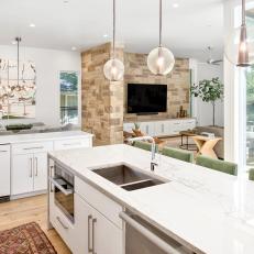 Open-Concept Kitchen With Glass Pendants